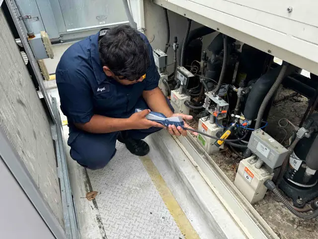 A&S technician running commercial refrigeration diagnostics