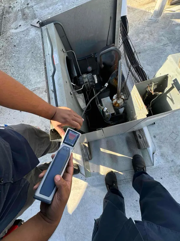 Refrigerant leak detector on an open commercial rooftop unit